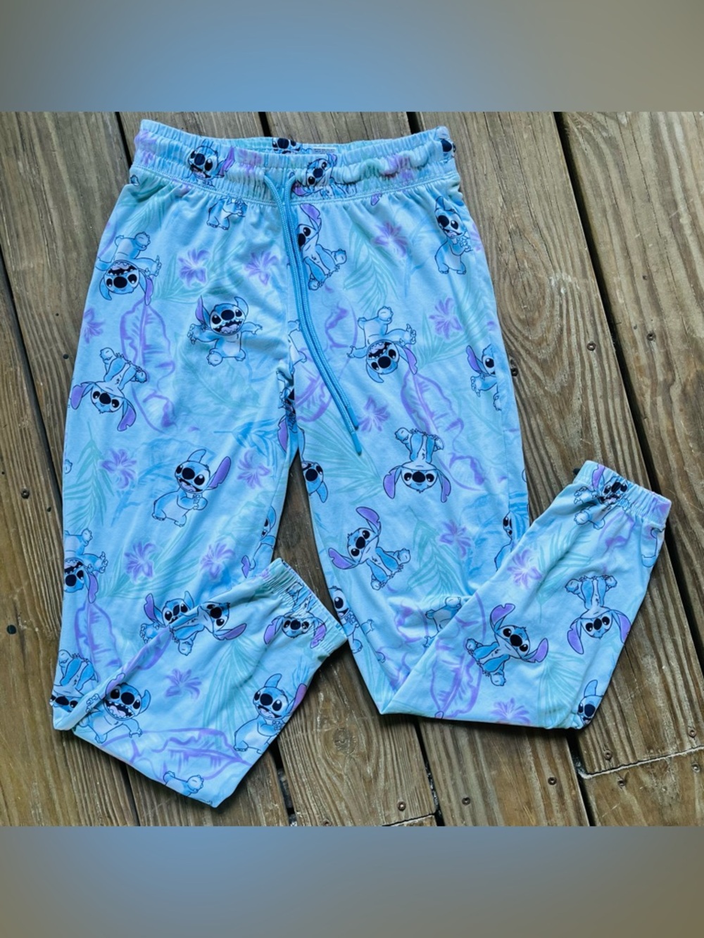 Disney's Lilo & Stitch tropical print PJ pants w/ banded cuff & floral pattern.